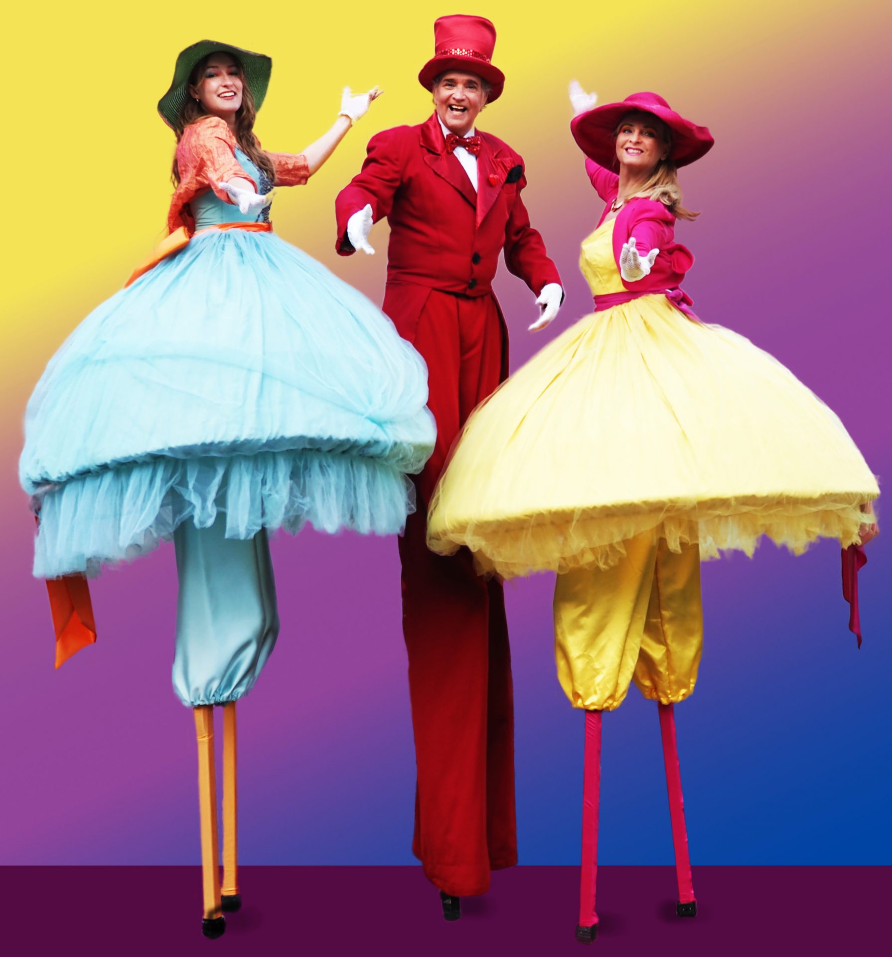 Drei Stelzengeher in festlich-bunten Kostümen – Williams-Entertainment & friends